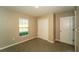 Neutral bedroom featuring a window, carpet and closet space for ample storage at 751 Jefferson St, Davenport, FL 33837