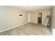 Bedroom with neutral walls, carpet, and views into the bathroom at 751 Jefferson St, Davenport, FL 33837