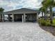 Open air community gathering area with tables, chairs, and ceiling fans at 751 Jefferson St, Davenport, FL 33837