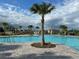 Relaxing community pool featuring palm trees at 751 Jefferson St, Davenport, FL 33837