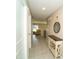 Hallway with tile floors and light walls leads to a living area at 751 Jefferson St, Davenport, FL 33837