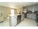 Kitchen features stainless appliances, granite countertops and dining area at 751 Jefferson St, Davenport, FL 33837