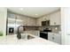 Kitchen featuring stainless appliances, granite countertops, gray cabinetry, and tiled backsplash at 751 Jefferson St, Davenport, FL 33837