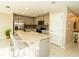Kitchen with stainless appliances, lots of cabinets and large island at 751 Jefferson St, Davenport, FL 33837