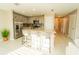 Kitchen featuring granite countertops, stainless steel appliances, and a breakfast bar with seating at 751 Jefferson St, Davenport, FL 33837