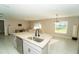 Living room features granite countertop kitchen island and neutral color palette at 751 Jefferson St, Davenport, FL 33837