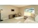 Bright living room featuring neutral colored furniture, tile floor, and recessed lighting at 751 Jefferson St, Davenport, FL 33837