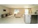 Bright and open living space features a breakfast bar and modern furnishings at 751 Jefferson St, Davenport, FL 33837