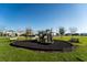 Well-maintained community playground with swings and a slide at 751 Jefferson St, Davenport, FL 33837