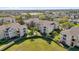 Aerial view of the complex showcasing lush landscaping, palm trees, and walkways at 8103 Coconut Palm Way # 205, Kissimmee, FL 34747