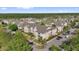 Attractive aerial view of complex showing manicured lawns, mature trees, and ample parking at 8103 Coconut Palm Way # 205, Kissimmee, FL 34747