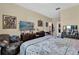 Bedroom featuring neutral walls, tv, a large window, dresser and closet at 8103 Coconut Palm Way # 205, Kissimmee, FL 34747