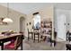Dining room with view to open kitchen area with breakfast bar and wine and drink rack at 8103 Coconut Palm Way # 205, Kissimmee, FL 34747