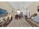 Spacious living room with neutral carpeting, dining area, and cozy furnishings at 8103 Coconut Palm Way # 205, Kissimmee, FL 34747