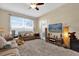 Bright living room with comfortable seating, large window, and stylish decor at 8103 Coconut Palm Way # 205, Kissimmee, FL 34747