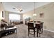 Inviting living room features a ceiling fan and neutral carpeting throughout the space at 8103 Coconut Palm Way # 205, Kissimmee, FL 34747