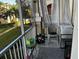 The inviting screened patio offers a cozy seating area with views of the manicured lawn and landscape at 8103 Coconut Palm Way # 205, Kissimmee, FL 34747