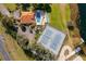 Overhead view of community amenities including pool, tennis courts and verdant landscaping at 8507 Waterview Way, Winter Haven, FL 33884
