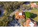 Aerial view of townhome community with mature trees, parking, and beautiful landscaping at 8507 Waterview Way, Winter Haven, FL 33884