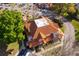 Aerial view of townhomes featuring red tile roofs, mature trees, and nearby parking at 8507 Waterview Way, Winter Haven, FL 33884