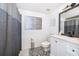 Charming bathroom featuring modern black and white patterned tile floors and stylish decor at 8507 Waterview Way, Winter Haven, FL 33884