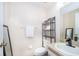 Cozy bathroom featuring a sleek black vanity faucet and decorative wall accents at 8507 Waterview Way, Winter Haven, FL 33884