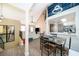 A bright and airy living room features vaulted ceilings, an open floor plan, and seamless connectivity to the kitchen at 8507 Waterview Way, Winter Haven, FL 33884