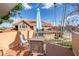 Enjoy outdoor living on this cozy patio with views of a beautiful terracotta-roofed community at 8507 Waterview Way, Winter Haven, FL 33884