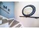 Stairway decorated with a decorative mirror and modern railing at 8507 Waterview Way, Winter Haven, FL 33884