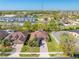 A panoramic aerial view showcasing a well-planned community with neatly arranged homes and green spaces, highlighting neighborhood layout at 1004 Costa Mesa Ln, Kissimmee, FL 34744