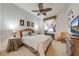 Cozy bedroom featuring a ceiling fan, soft lighting, and a relaxing atmosphere with comfortable furnishings at 1004 Costa Mesa Ln, Kissimmee, FL 34744