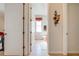 Hallway view leading to a bathroom with tile floors and updated vanity at 1004 Costa Mesa Ln, Kissimmee, FL 34744