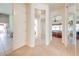 Hallway with mirrored closet doors leading to the main bedroom and bathroom at 1004 Costa Mesa Ln, Kissimmee, FL 34744