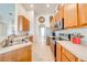 Galley kitchen featuring stainless steel appliances and abundant cabinet space at 1004 Costa Mesa Ln, Kissimmee, FL 34744