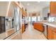Bright kitchen with stainless steel refrigerator, oven, and ample counter space at 1004 Costa Mesa Ln, Kissimmee, FL 34744