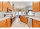 Well-lit kitchen featuring ample cabinetry, stainless steel appliances, and a breakfast nook at 1004 Costa Mesa Ln, Kissimmee, FL 34744
