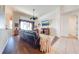 Spacious living area featuring hardwood floors, a cozy sofa, and large windows, offering a comfortable and inviting atmosphere at 1004 Costa Mesa Ln, Kissimmee, FL 34744