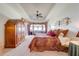 Spacious main bedroom with tray ceiling, sitting area, and bay window at 1004 Costa Mesa Ln, Kissimmee, FL 34744