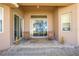 Inviting covered patio with seating, offering a relaxing outdoor space with pavers at 1004 Costa Mesa Ln, Kissimmee, FL 34744