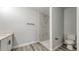 Clean bathroom featuring a marble tiled shower and modern toilet, ready for relaxation at 1013 Cannes Dr, Kissimmee, FL 34759