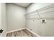 Functional laundry room with a wire shelf, ready for washer and dryer hookups at 1013 Cannes Dr, Kissimmee, FL 34759