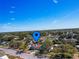 Aerial view of the neighborhood and charming home, showcasing its location and surrounding landscape at 103 W Maple St, Davenport, FL 33837