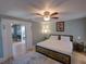 Comfortable bedroom with a ceiling fan, wood accents, and stylish decor at 103 W Maple St, Davenport, FL 33837
