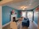 Bright living room features a decorative fireplace, and lots of seating at 103 W Maple St, Davenport, FL 33837