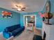 Inviting living room featuring a decorative fireplace, modern furniture, and bright, cheerful decor at 103 W Maple St, Davenport, FL 33837