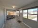Bright sunroom with tiled floors, comfortable seating, and lots of natural light at 103 W Maple St, Davenport, FL 33837