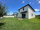 Spacious backyard with green grass and a patio with chairs at 1220 Hilltop Pl # 1220, St Cloud, FL 34772