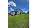 Spacious backyard with lush green grass, a patio and privacy fence at 1220 Hilltop Pl # 1220, St Cloud, FL 34772