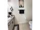 This half-bathroom features a granite countertop, modern fixtures, and tile flooring at 1220 Hilltop Pl # 1220, St Cloud, FL 34772