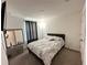 Clean bedroom boasts light and privacy from light blocking curtains at 1220 Hilltop Pl # 1220, St Cloud, FL 34772